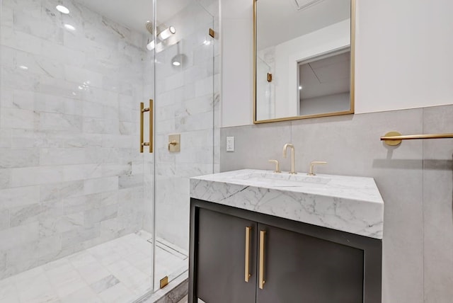 70 Rainey St Unit 1306, Austin, TX 78701 - full bathroom with a stall shower, vanity, and tile walls