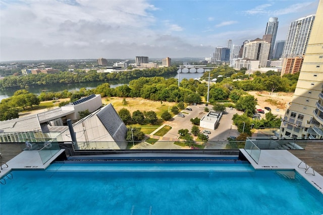 70 Rainey St Unit 1306, Austin, TX 78701 - view of pool featuring a city view and a water view