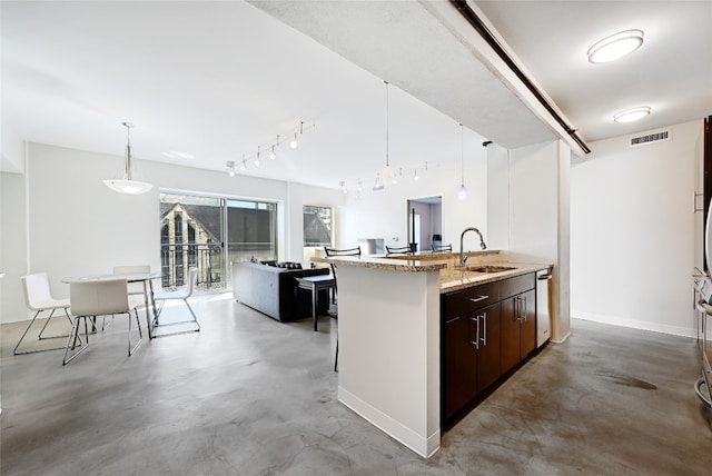 kitchen featuring visible vents, concrete floors, dark brown cabinetry, and pendant lighting