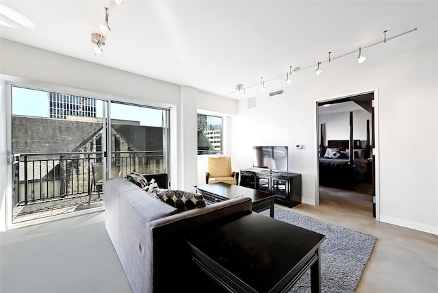 living room featuring concrete floors