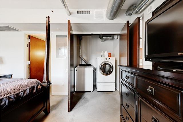 washroom featuring washer and clothes dryer and electric panel