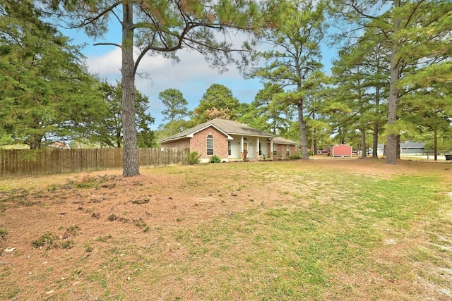 228 Old Firetower Rd, Bastrop, TX 78602 - view of yard with a porch and an outbuilding
