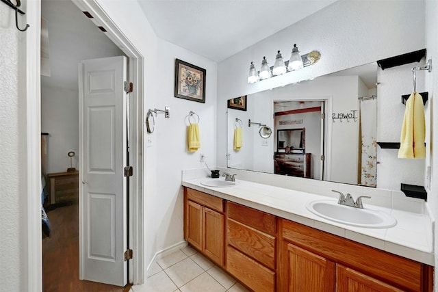 228 Old Firetower Rd, Bastrop, TX 78602 - bathroom featuring double vanity and tile patterned flooring