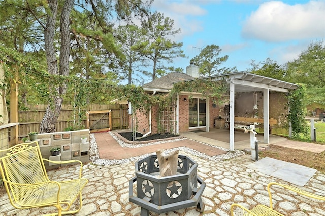 228 Old Firetower Rd, Bastrop, TX 78602 - view of patio / terrace featuring a fire pit