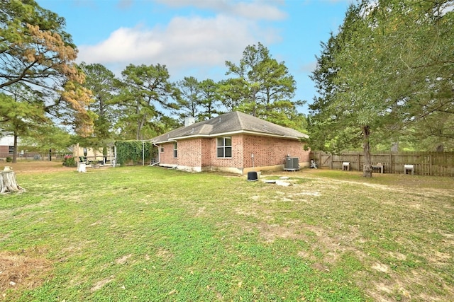 228 Old Firetower Rd, Bastrop, TX 78602 - view of home's exterior featuring central air condition unit and brick siding