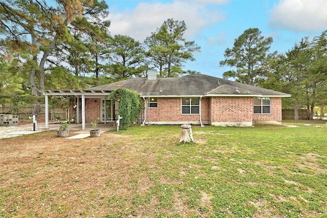 228 Old Firetower Rd, Bastrop, TX 78602 - rear view of property featuring a pergola, a patio area, a chimney, and brick siding