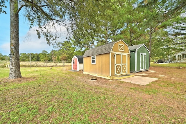 view of outbuilding featuring a yard