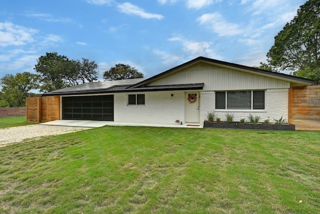 ranch-style house with a front yard and a garage