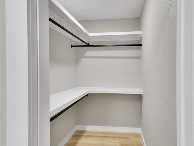 walk in closet featuring light wood-type flooring