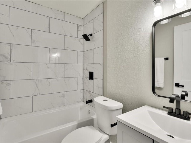 full bathroom with vanity, toilet, and tiled shower / bath