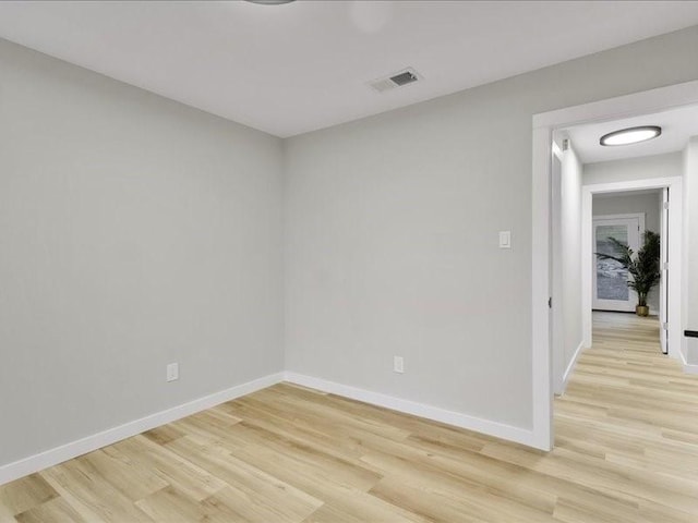 spare room featuring light wood-type flooring