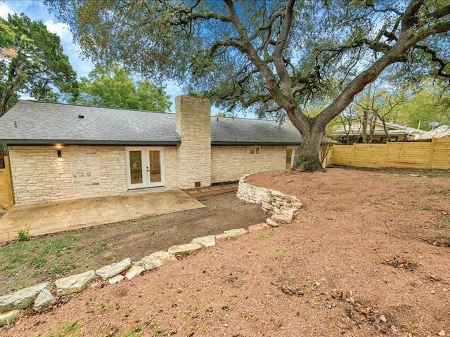 rear view of property featuring a patio area and french doors