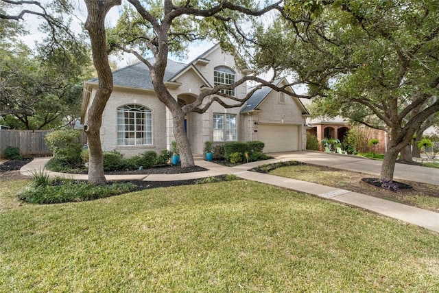 view of front of house with a front yard and a garage