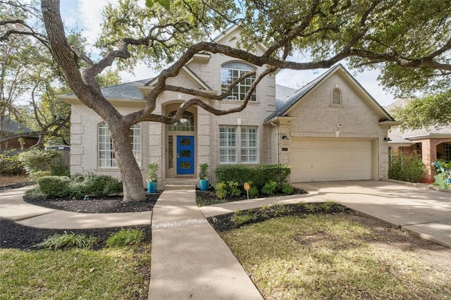 french country style house with a garage