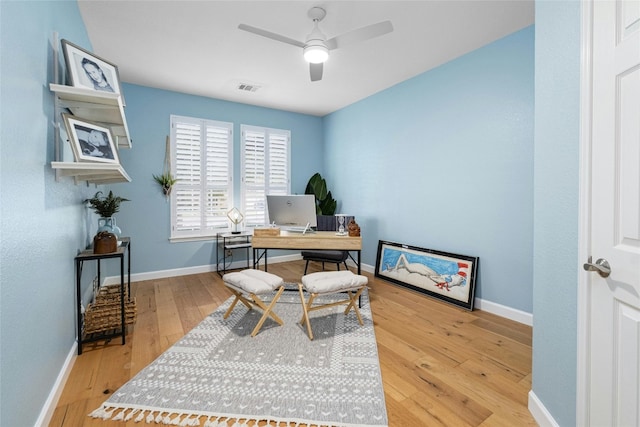 office with ceiling fan and wood-type flooring