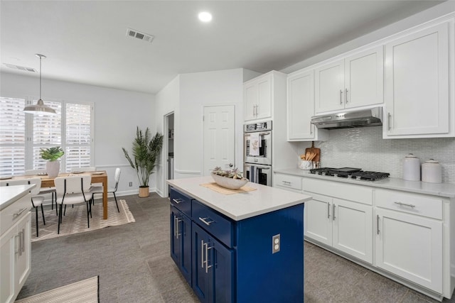 kitchen with white cabinets, pendant lighting, stainless steel appliances, and blue cabinets