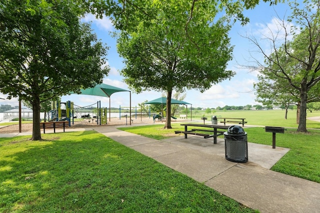 view of home's community with a lawn and a playground