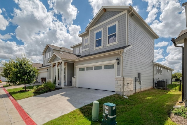 view of front of house featuring a front yard and a garage