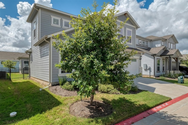 view of front of property with a garage, central AC unit, and a front yard