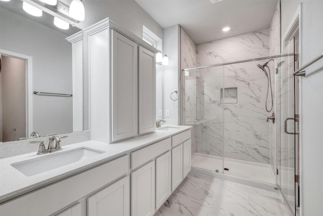 bathroom featuring vanity and a shower with shower door