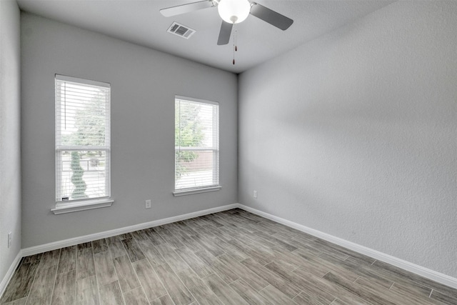 unfurnished room with ceiling fan and light hardwood / wood-style flooring