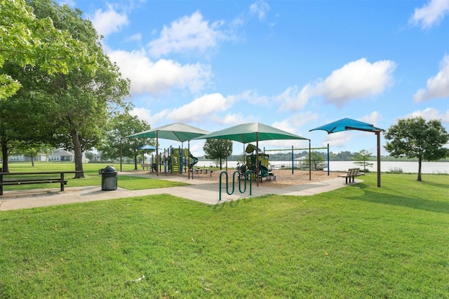 view of property's community with a lawn and a playground