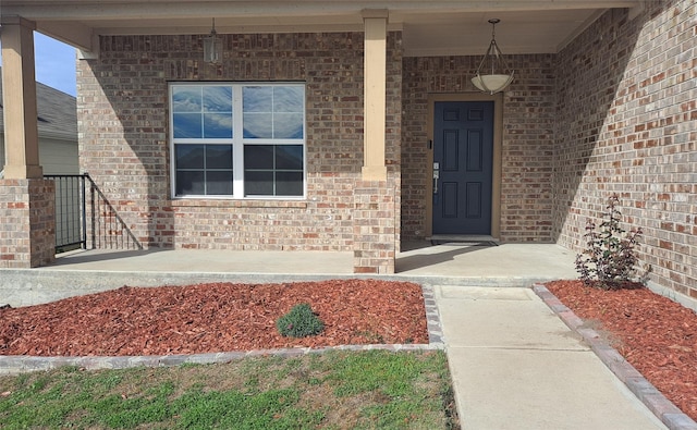 entrance to property featuring a porch