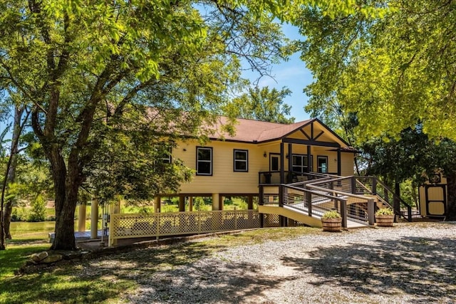 view of front of property featuring a wooden deck