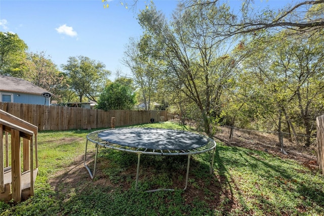 view of yard featuring a trampoline