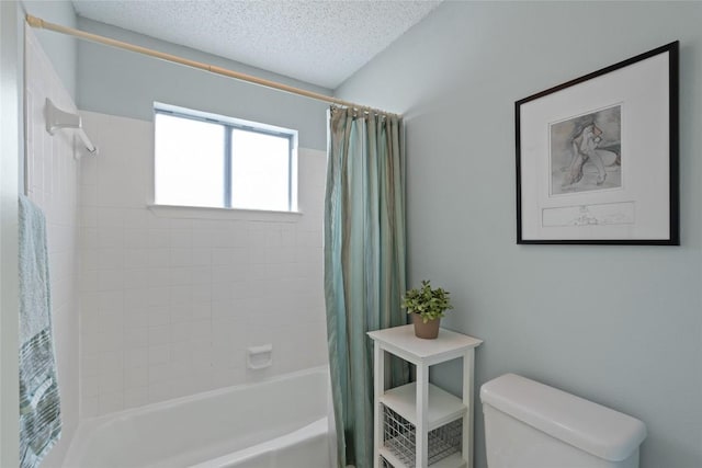 bathroom with shower / bath combo, toilet, and a textured ceiling