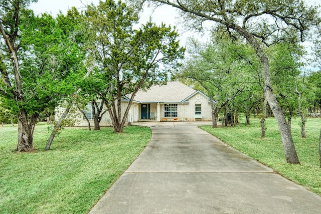 view of front of house with a front lawn and driveway