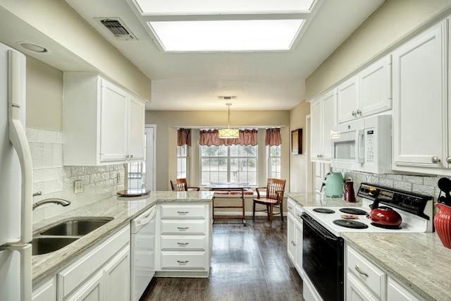 kitchen featuring visible vents, backsplash, white appliances, white cabinets, and dark wood-style flooring