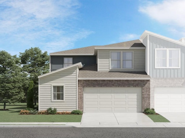 view of front of house featuring a front yard and a garage