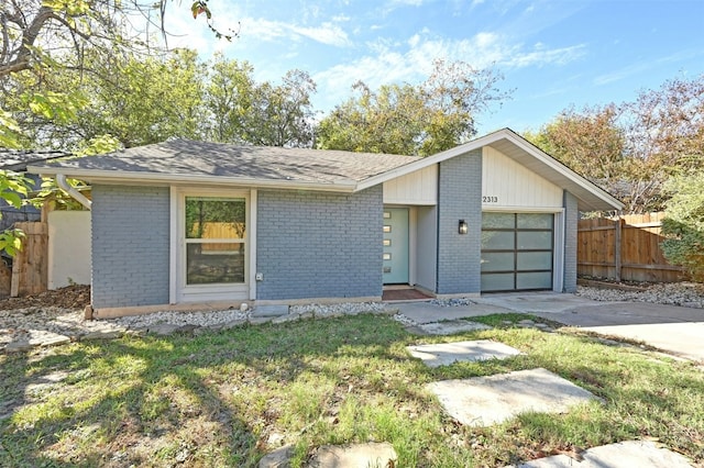 ranch-style house featuring a garage