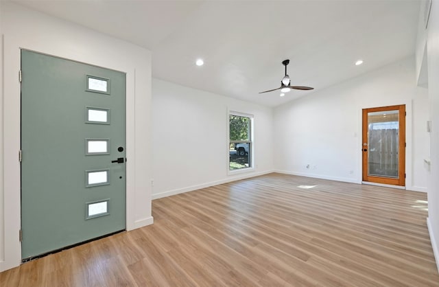 entryway with ceiling fan, light hardwood / wood-style floors, and lofted ceiling