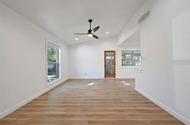 unfurnished living room with ceiling fan, light hardwood / wood-style flooring, and vaulted ceiling