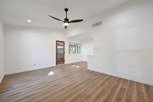 spare room featuring light hardwood / wood-style flooring and ceiling fan