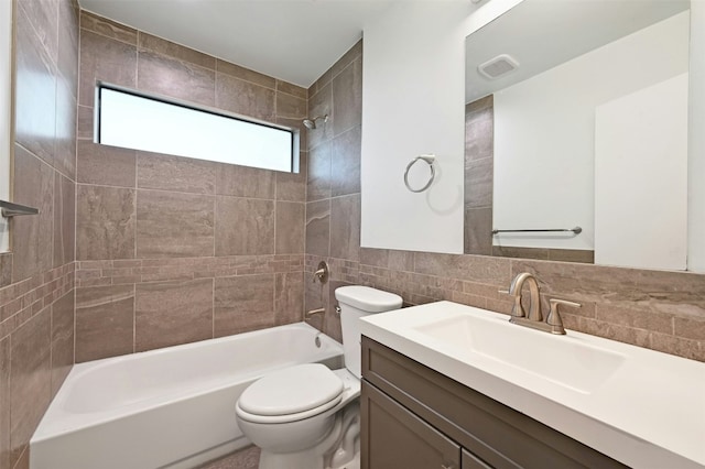 full bathroom featuring decorative backsplash, vanity, tile walls, toilet, and tiled shower / bath