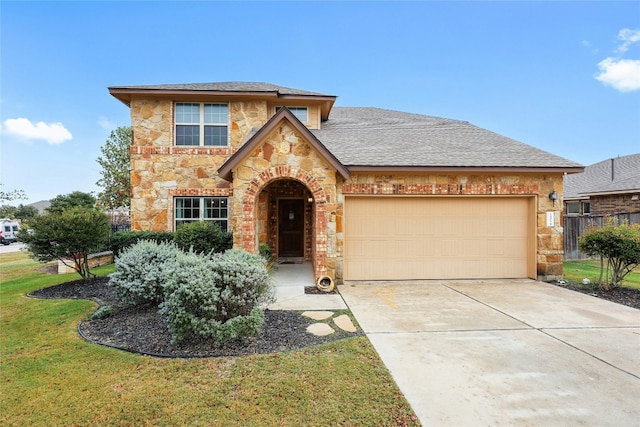 view of front facade featuring a garage and a front lawn