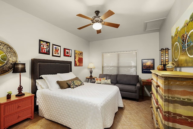 bedroom with light hardwood / wood-style flooring and ceiling fan