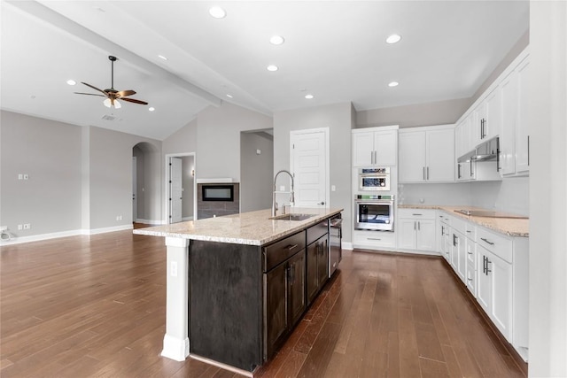 20701 Deep Crk, Lago Vista, TX 78645 - kitchen featuring a sink, ceiling fan, dark brown cabinets, stainless steel appliances, and white cabinets