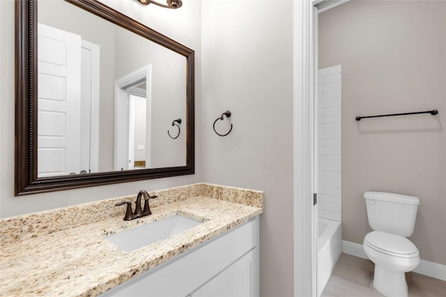 20701 Deep Crk, Lago Vista, TX 78645 - bathroom with vanity, toilet, baseboards, and tub / shower combination