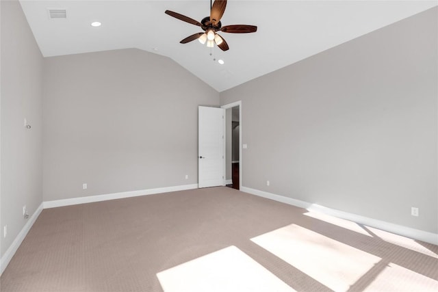 unfurnished room with carpet floors, vaulted ceiling, and ceiling fan