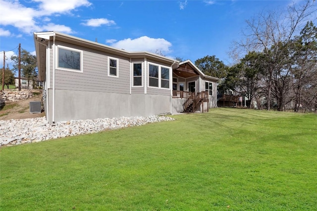 20701 Deep Crk, Lago Vista, TX 78645 - rear view of house with stairs, a yard, cooling unit, and a deck