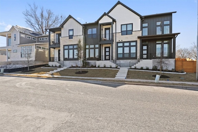 view of front of house with a balcony