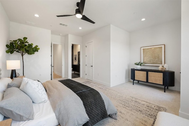 bedroom featuring light carpet and ceiling fan