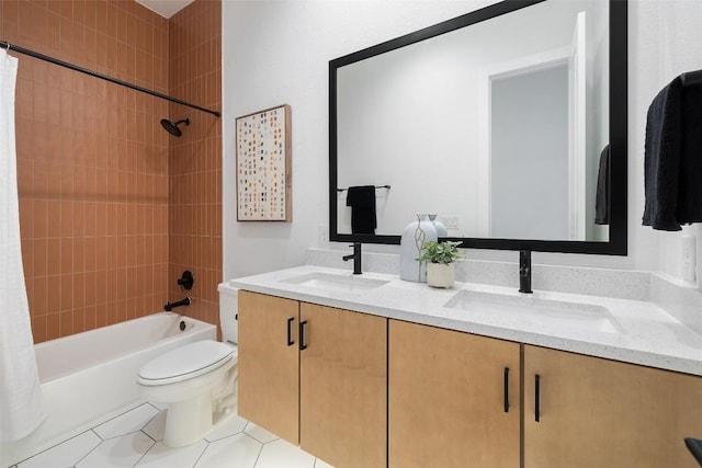 full bathroom featuring tile patterned floors, shower / bath combo with shower curtain, vanity, and toilet