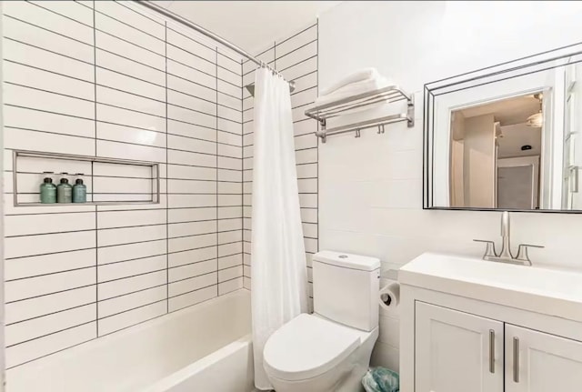 full bathroom featuring vanity, toilet, and shower / bathtub combination with curtain