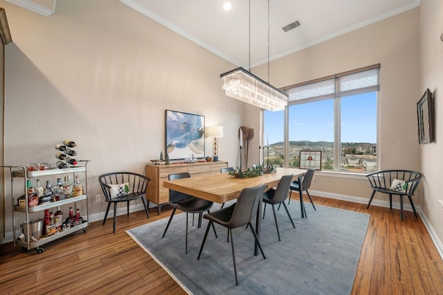 203 Serene Hilltop Cir, Lakeway, TX 78738 - dining area with hardwood / wood-style flooring, baseboards, crown molding, and recessed lighting