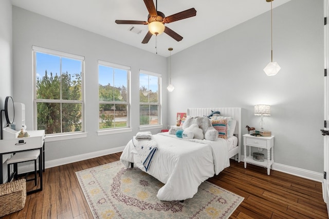 bedroom featuring dark hardwood / wood-style flooring and ceiling fan